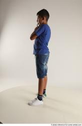 TIMBO STANDING POSE WITH GUN